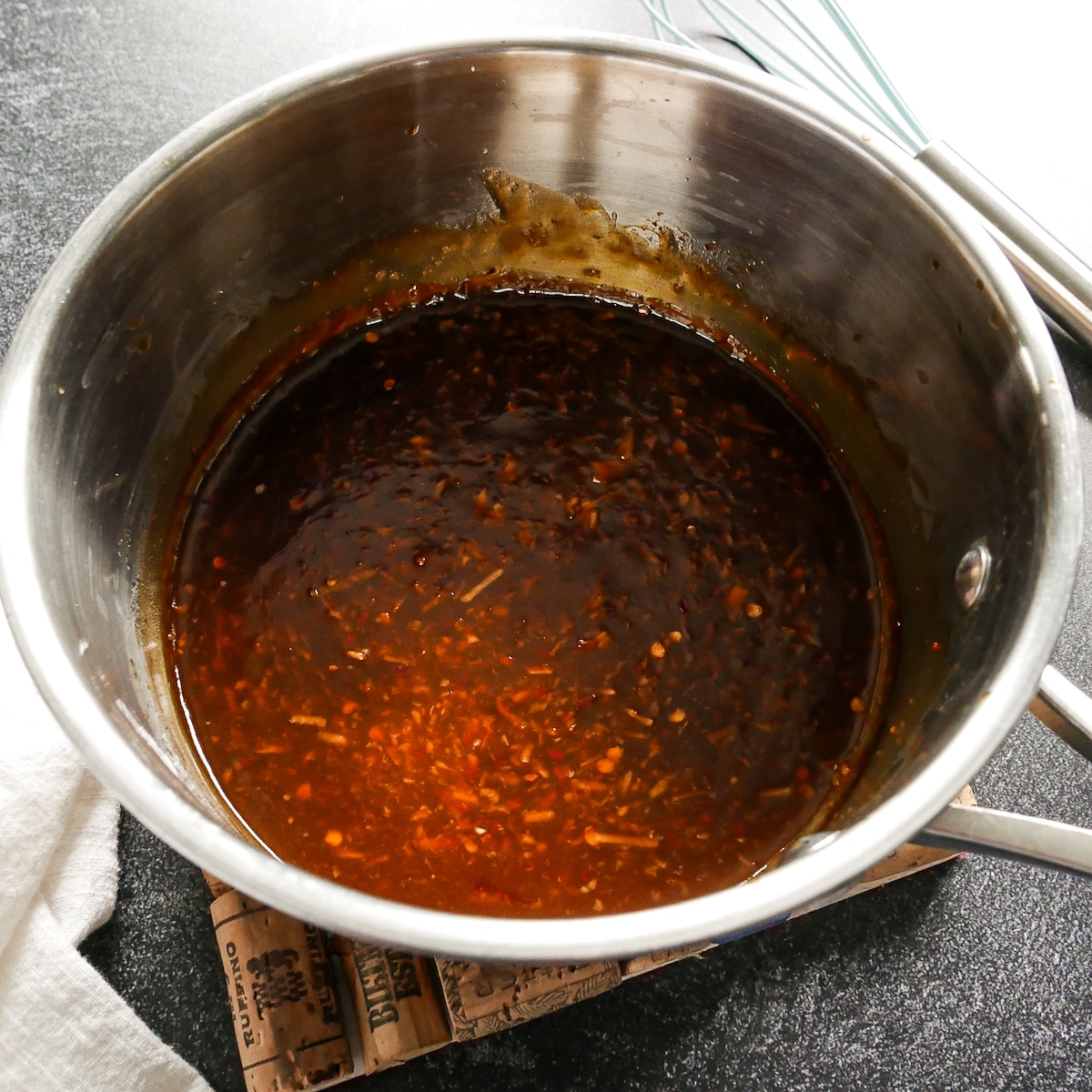 chile-paste-mixture-in-saucepan.jpg Chile paste and soy sauce mixture cooked in a saucepan.