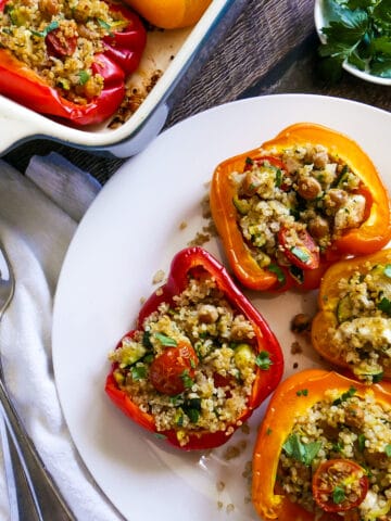 vegetarian stuffed peppers on a white plate.