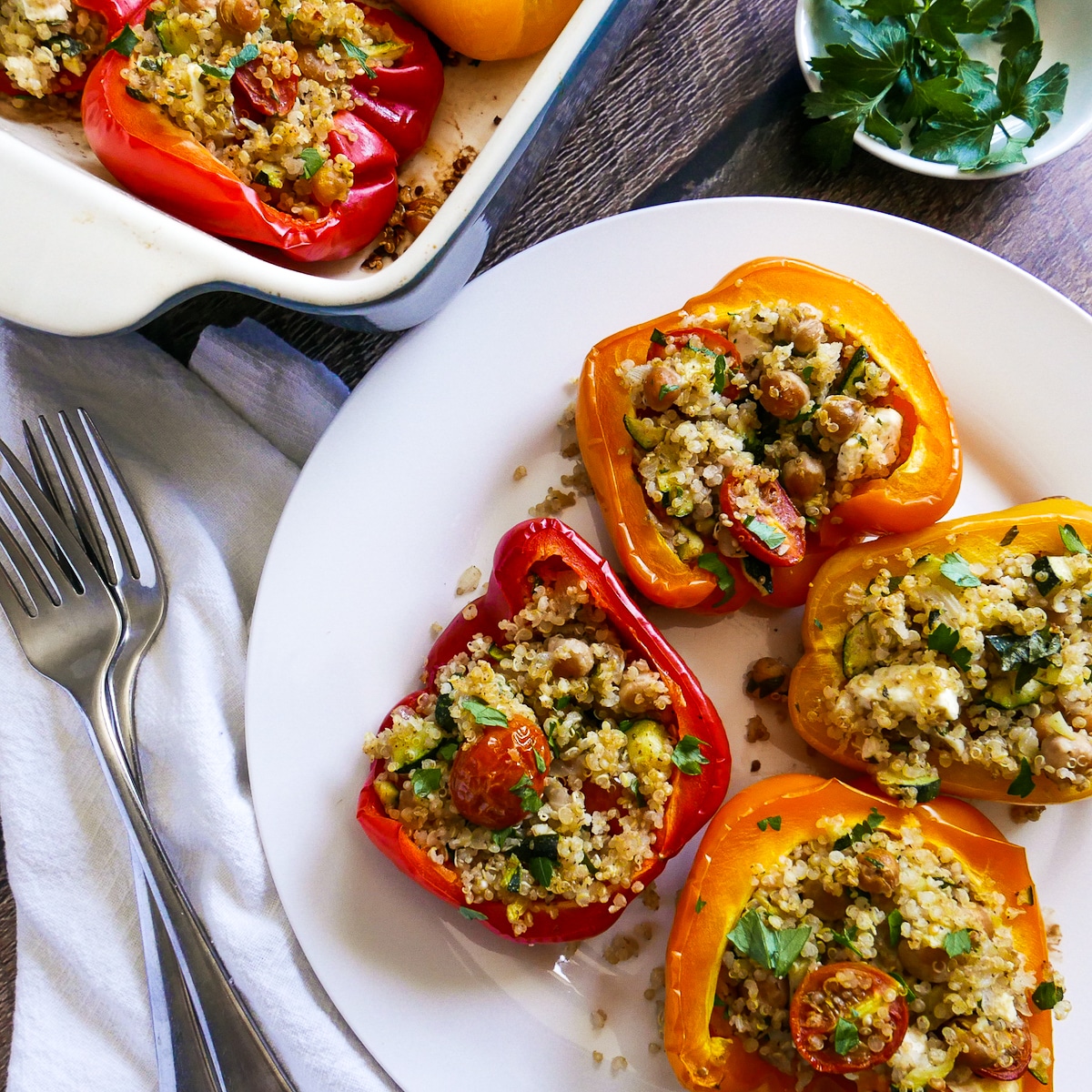 stuffed-peppers-on-a-plate.jpg vegetarian stuffed peppers on a white plate.