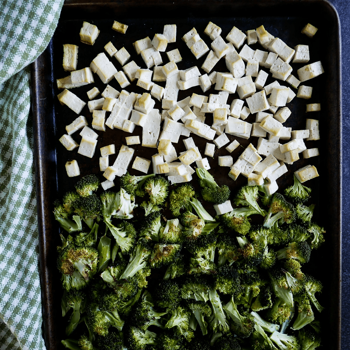 roasted-tofu-and-broccoli.jpg Roasted tofu and broccoli arranged on a baking sheet with a napkin underneath.