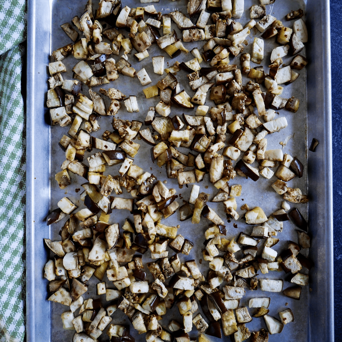 roasted-eggplant.jpg Diced and roasted eggplant on a baking sheet.