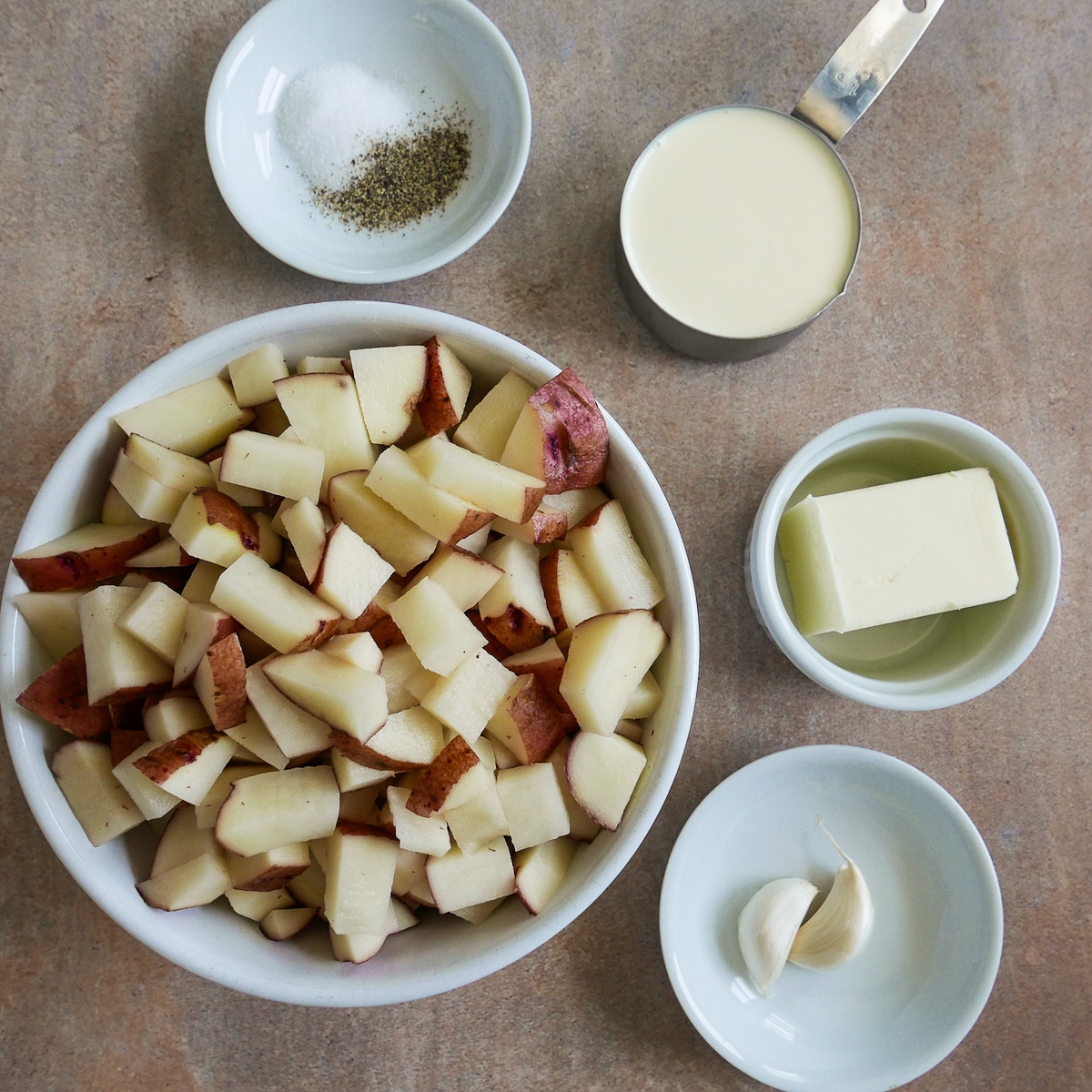 mashed potato ingredients arranged on a table.