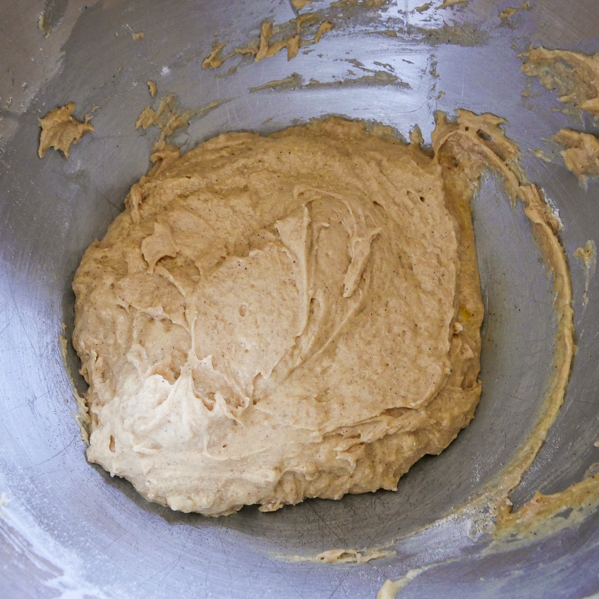 dry ingredients and sour cream mixed into cake batter.