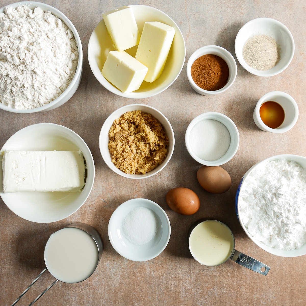 cinnamon roll ingredients arranged on a table.