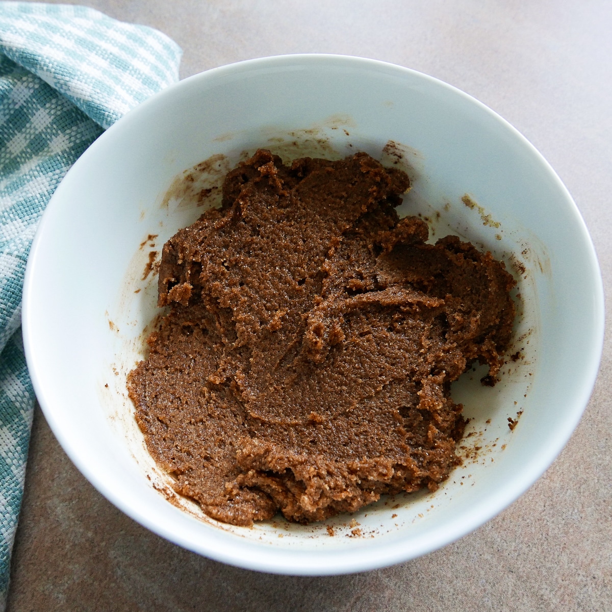 brown sugar and cinnamon filling in a small white bowl on top of a napkin. 