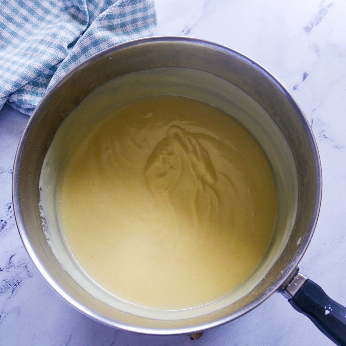 thick pudding filling in saucepan. 