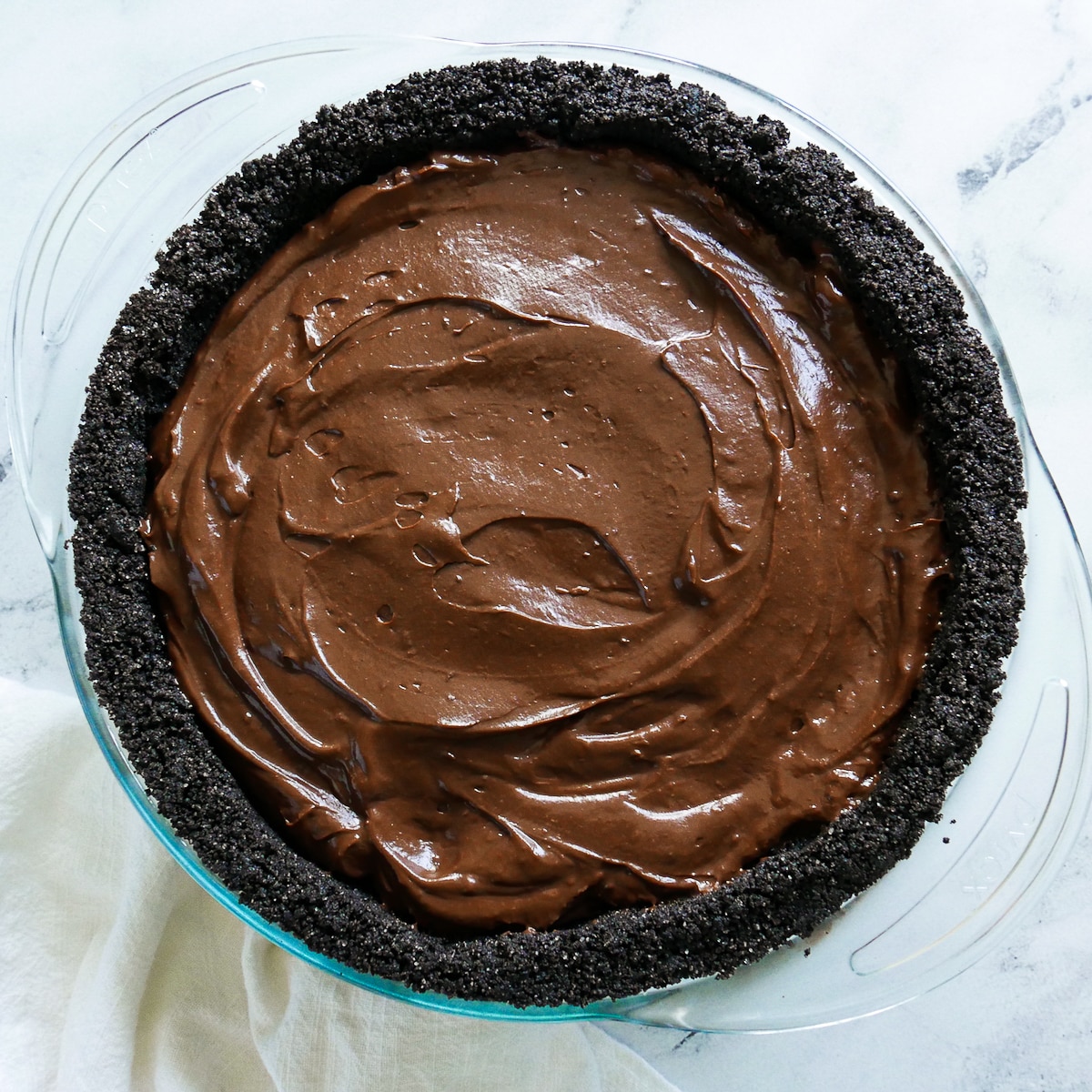 Chocolate filling poured into cookie crust. 