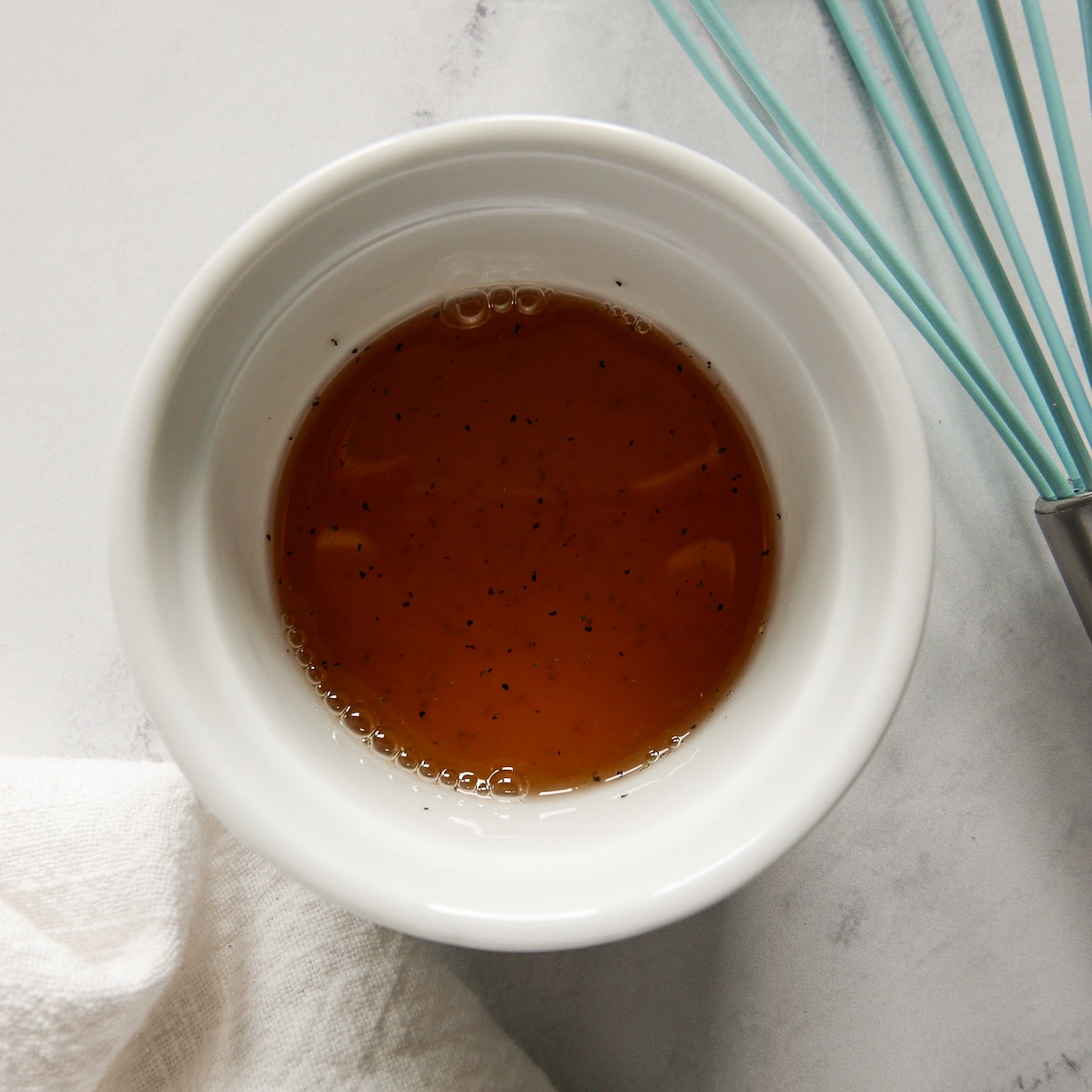 lemon vinaigrette whisked in a small cup.