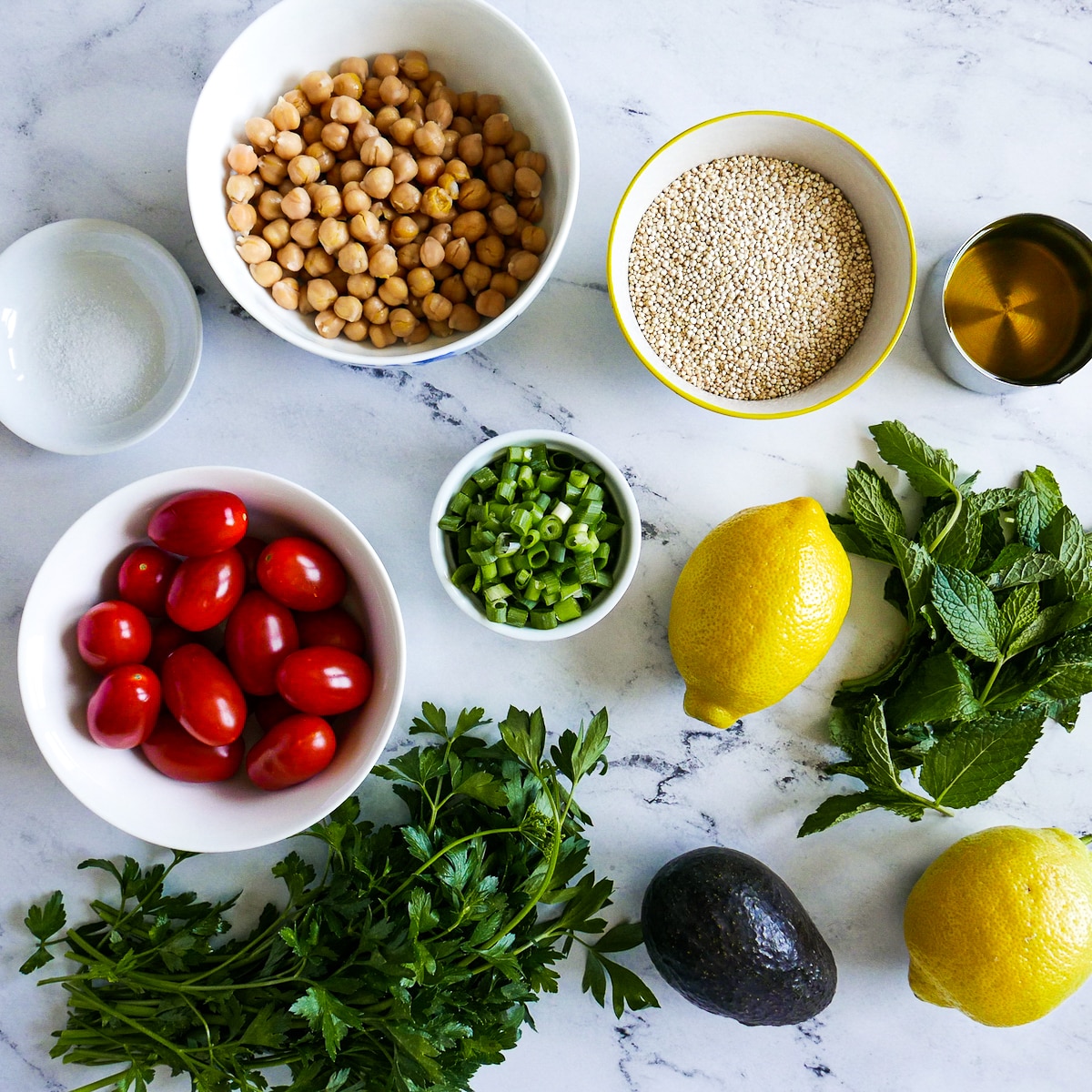 tabbouleh ingredients arranged on a table.