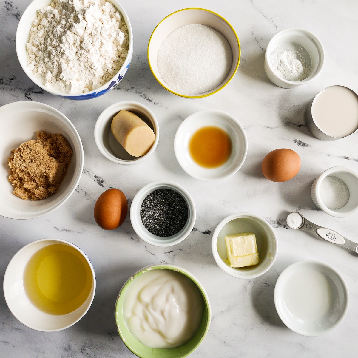 muffin-ingredients.jpg muffin ingredients arranged on a table.