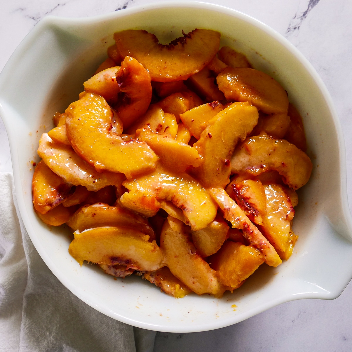 peaches tossed with cornstarch, lemon juice, and other ingredients.