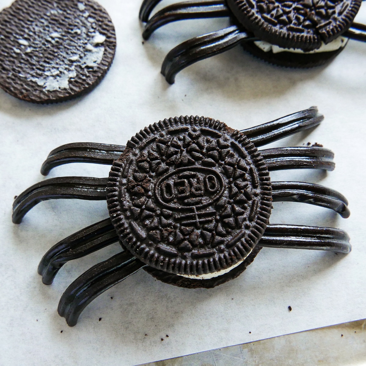 assembled oreo cookie with licorice legs.