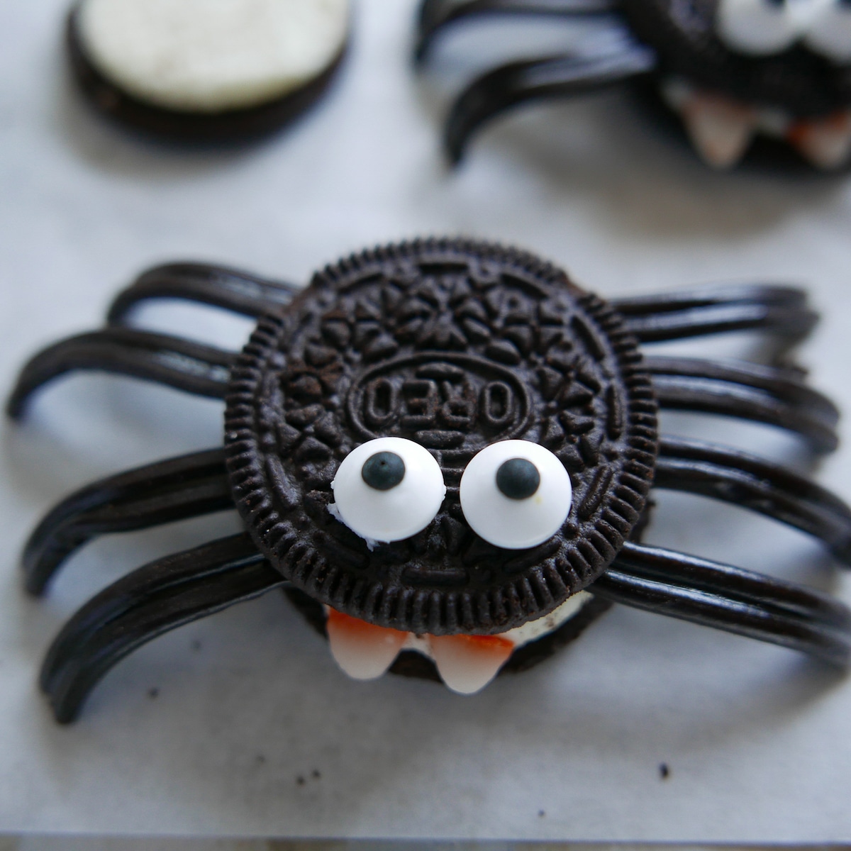 spider cookie placed on a white plate.