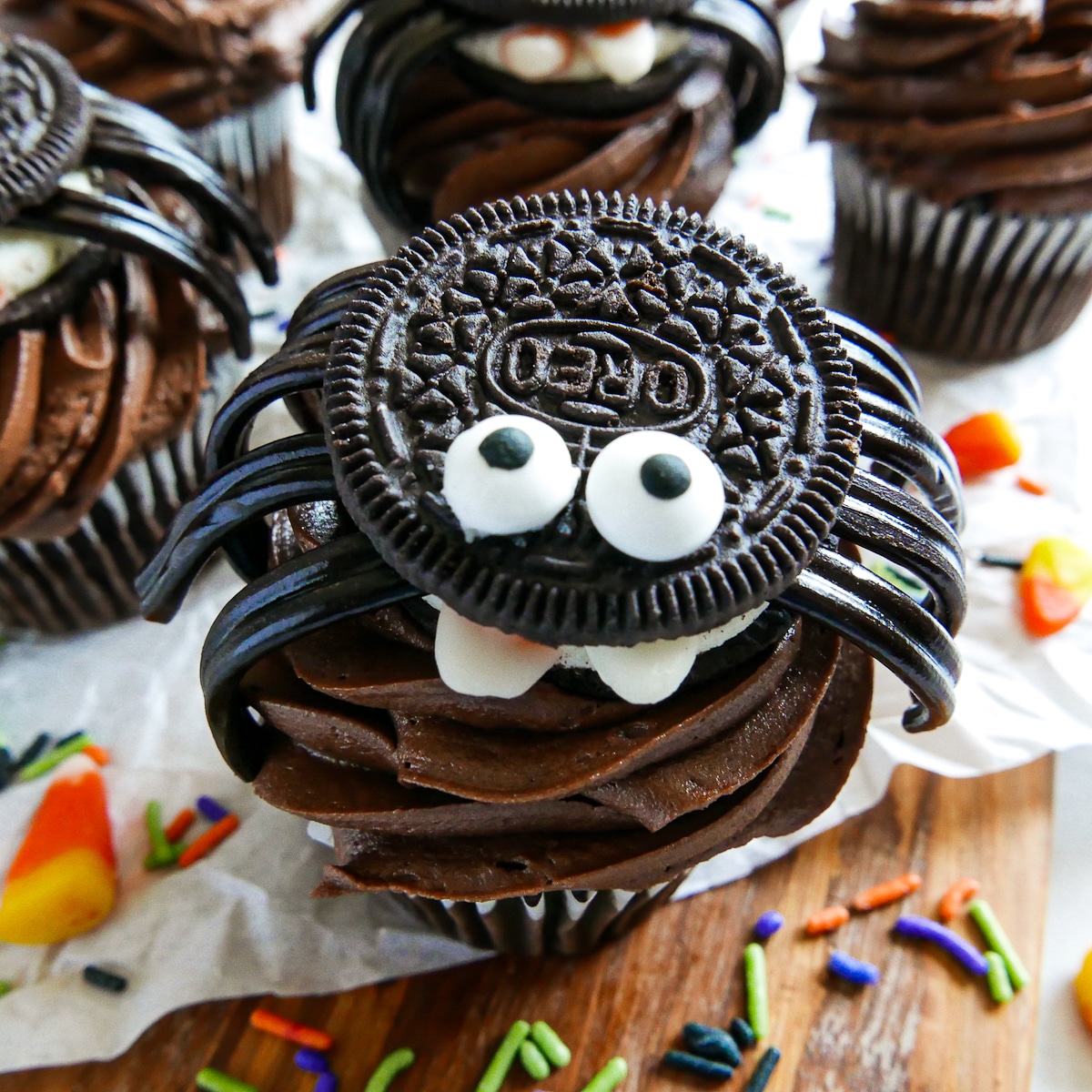 cookie spider placed on a chocolate cupcake.