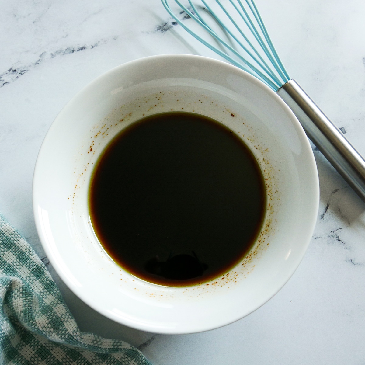 olive oil and molasses whisked in a small bowl.