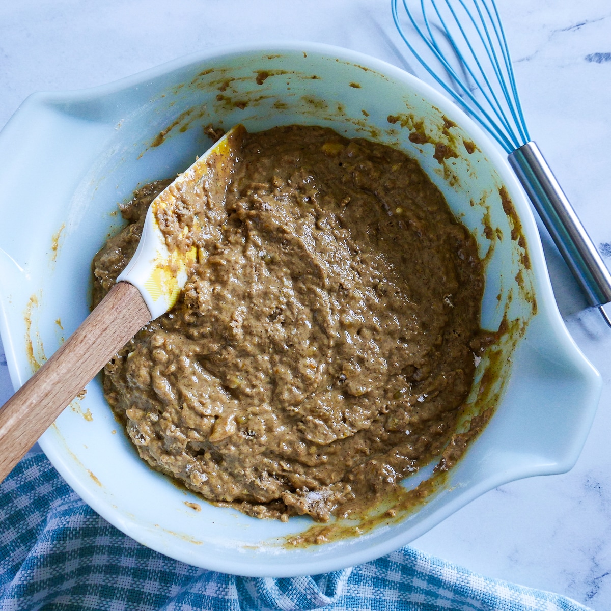 muffin batter combined in a mixing bowl.