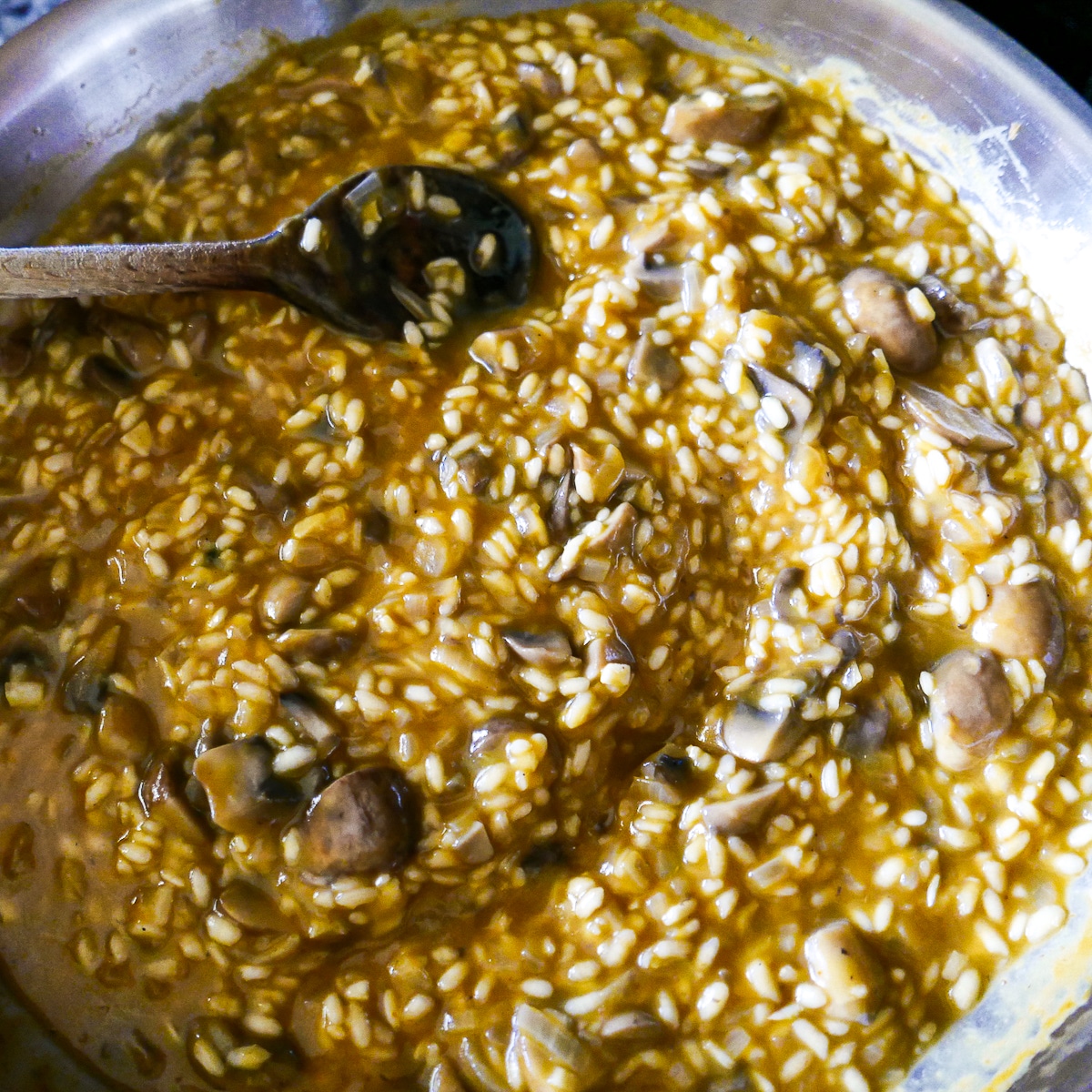 liquid mixture added to rice mixture in skillet.