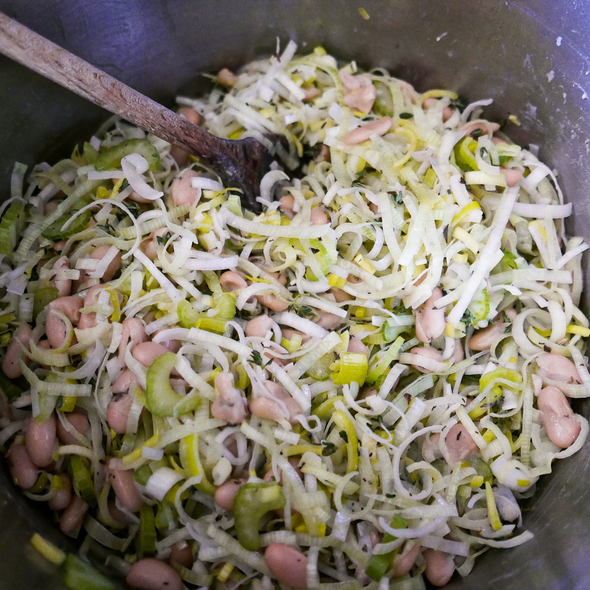 beans-and-broth-in-pot.jpg white beans, herbs, and vegetable broth added to cooking mixture.