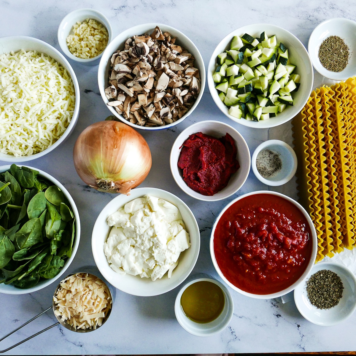 lasagna ingredients arranged on a table.