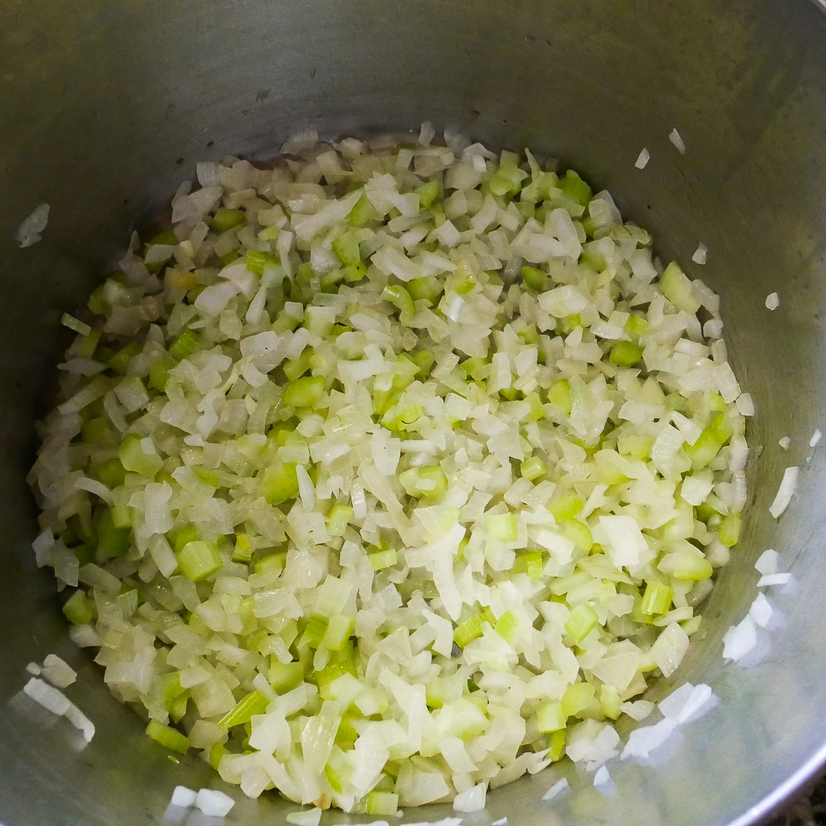 onion-and-celery-cooking.jpg onion and celery cooking in a large pot.