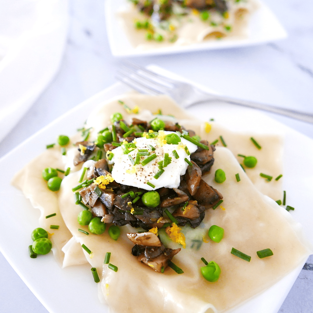 plate of wonton wrapper ravioli with a fork and napkin.