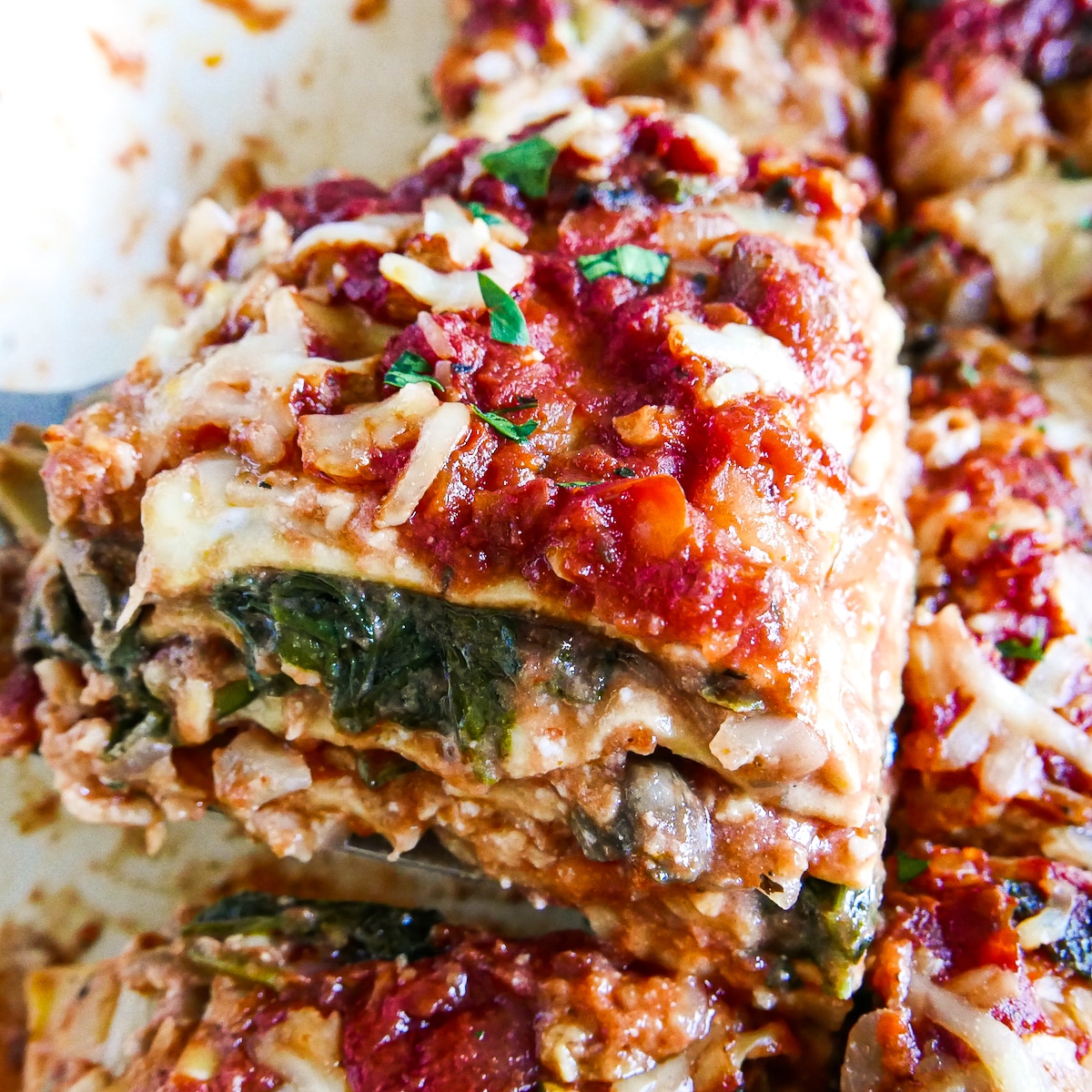 slice-of-lasagna-being-served.jpg slice of lasagna being served with a spatula.
