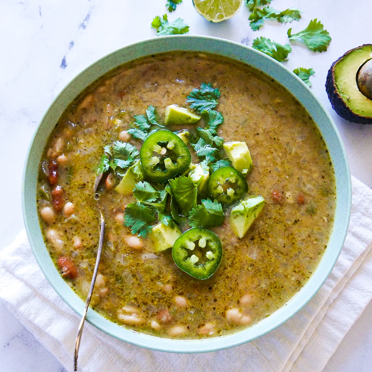 bowl-of-vegetarian-chili.jpg bowl of vegetarian chili with a spoon on a napkin.
