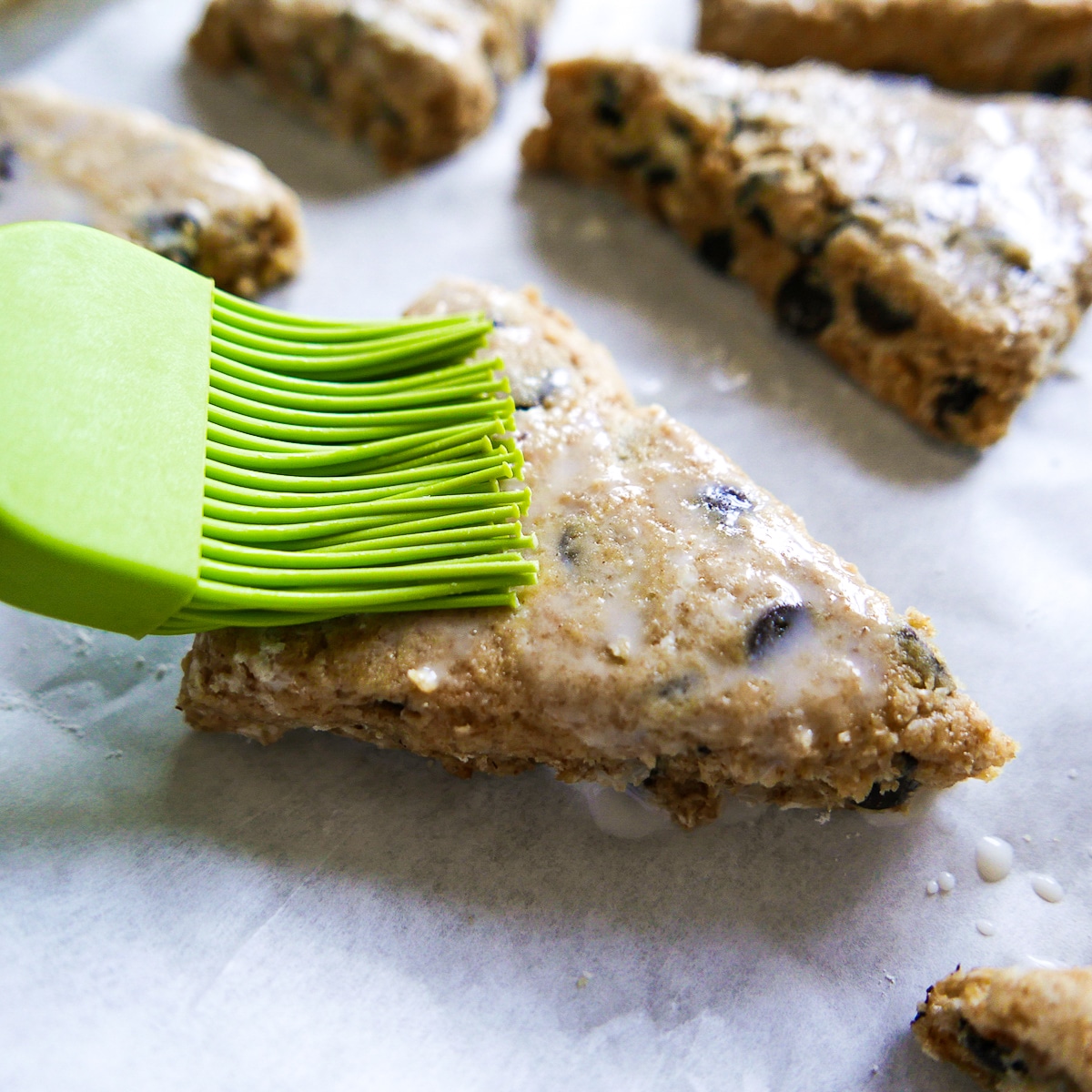 brushing heavy cream on tops of scones.