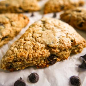 sourdough discard scones arranged on a parchment-lined baking sheet.