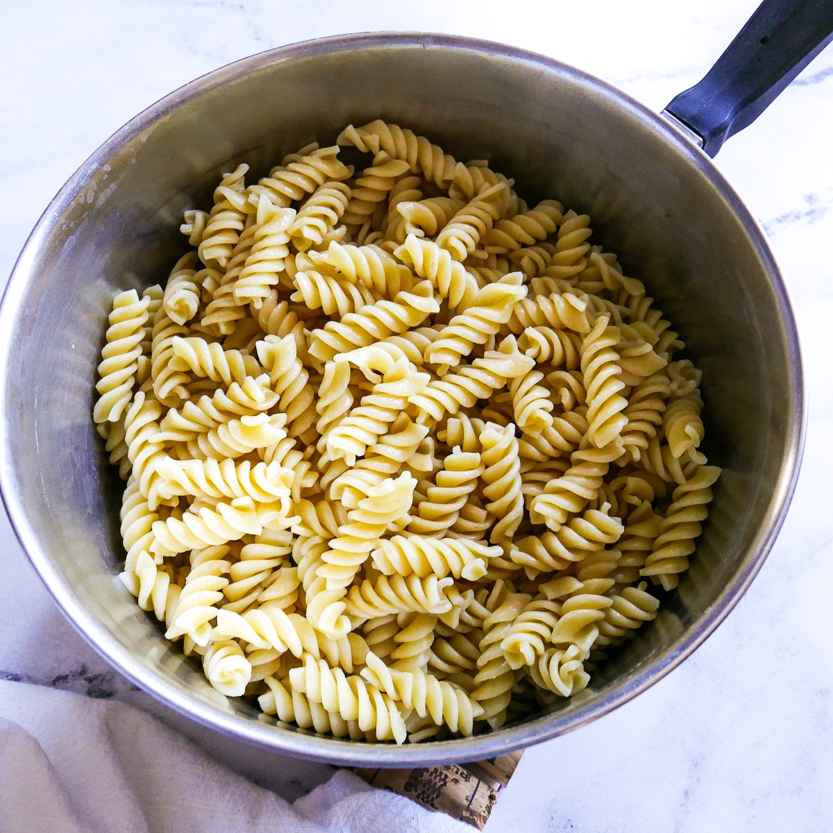 cooked and drained pasta in a pot.
