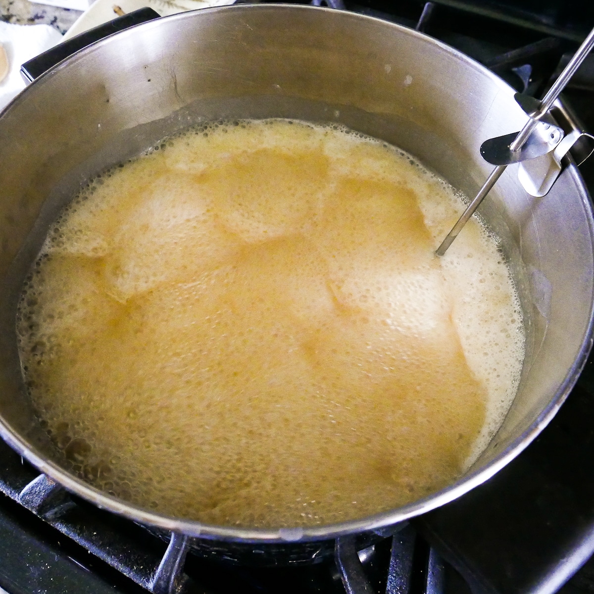 boiling caramel in a large pot.