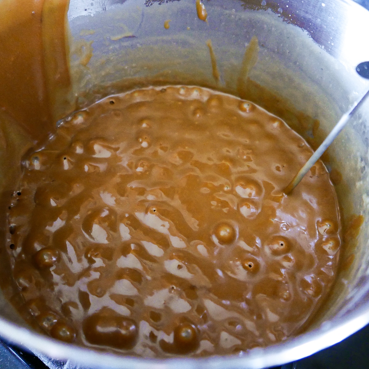 salt being mixed into caramel mixture.