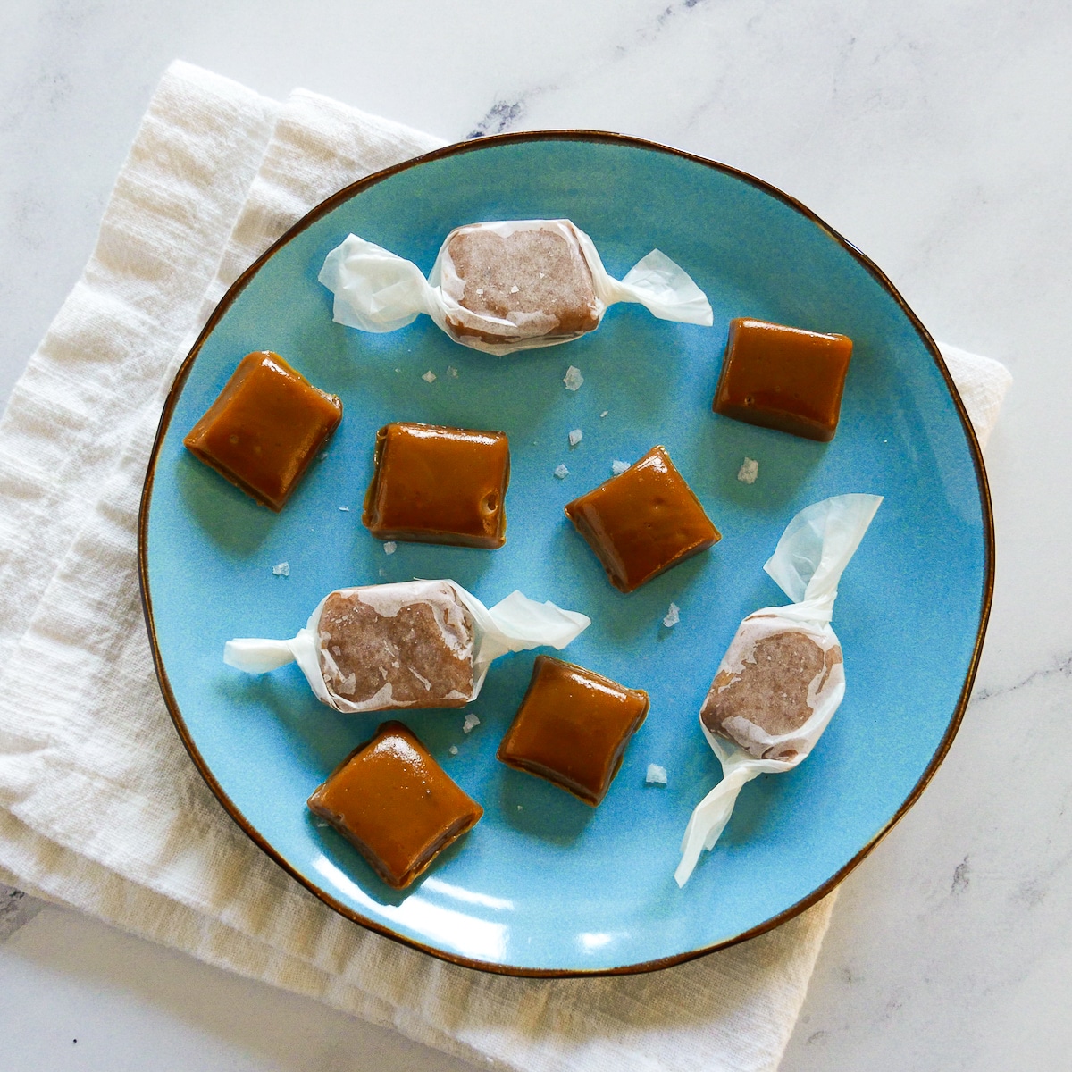caramels-on-blue-plate.jpg homemade salted caramels arranged on a blue plate.