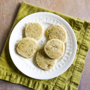 lemon shortbread cookies arranged on a white plate.