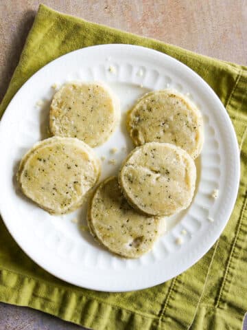 lemon shortbread cookies arranged on a white plate.