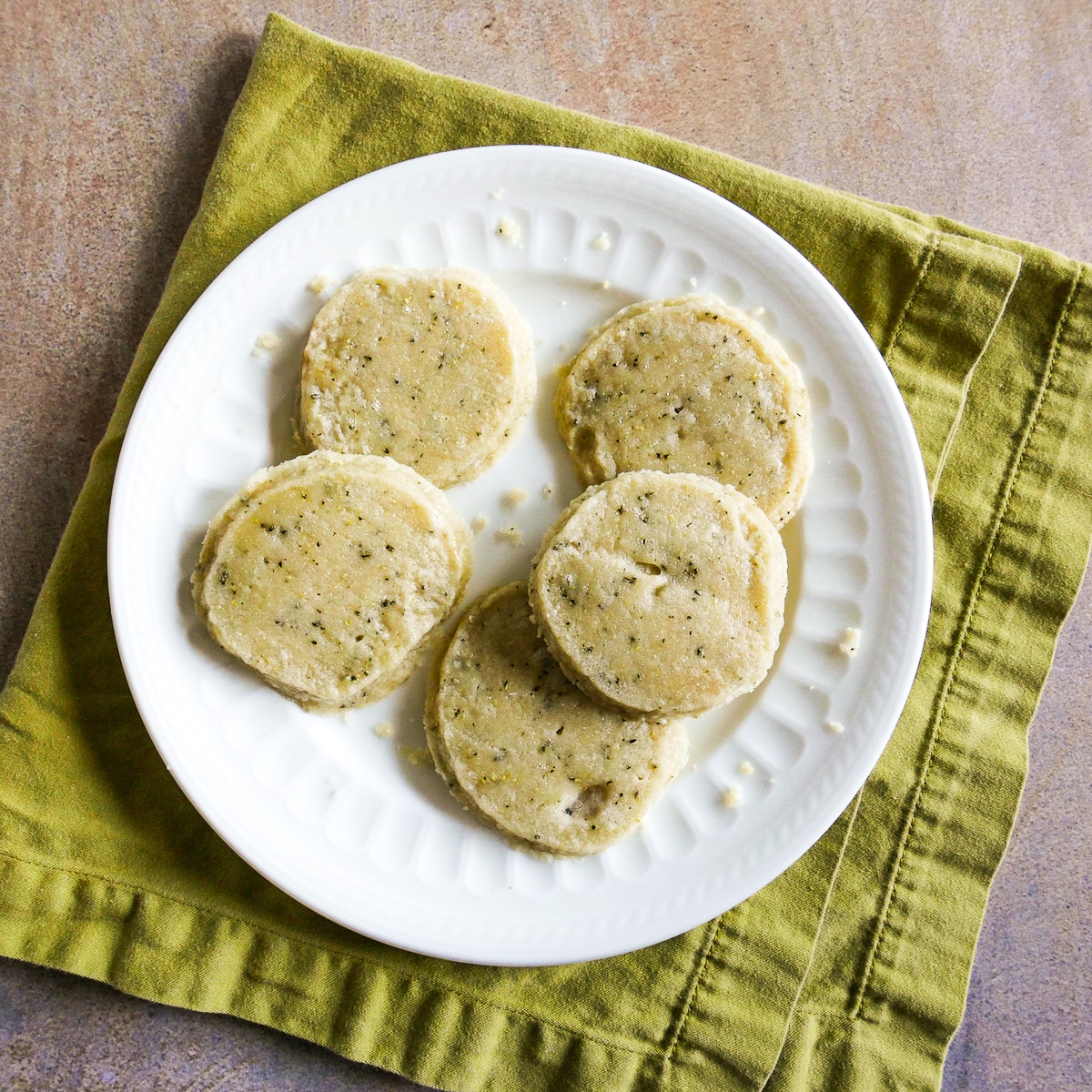 Shortbread cookies arranged on a white plate.