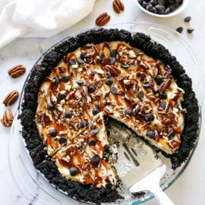 pie server resting in a pie pan with cut into pie.