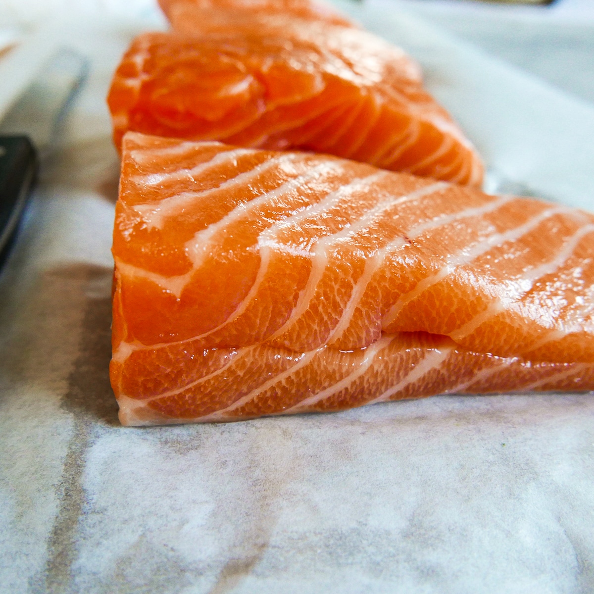 salmon fillet with a pocket cut into the side.