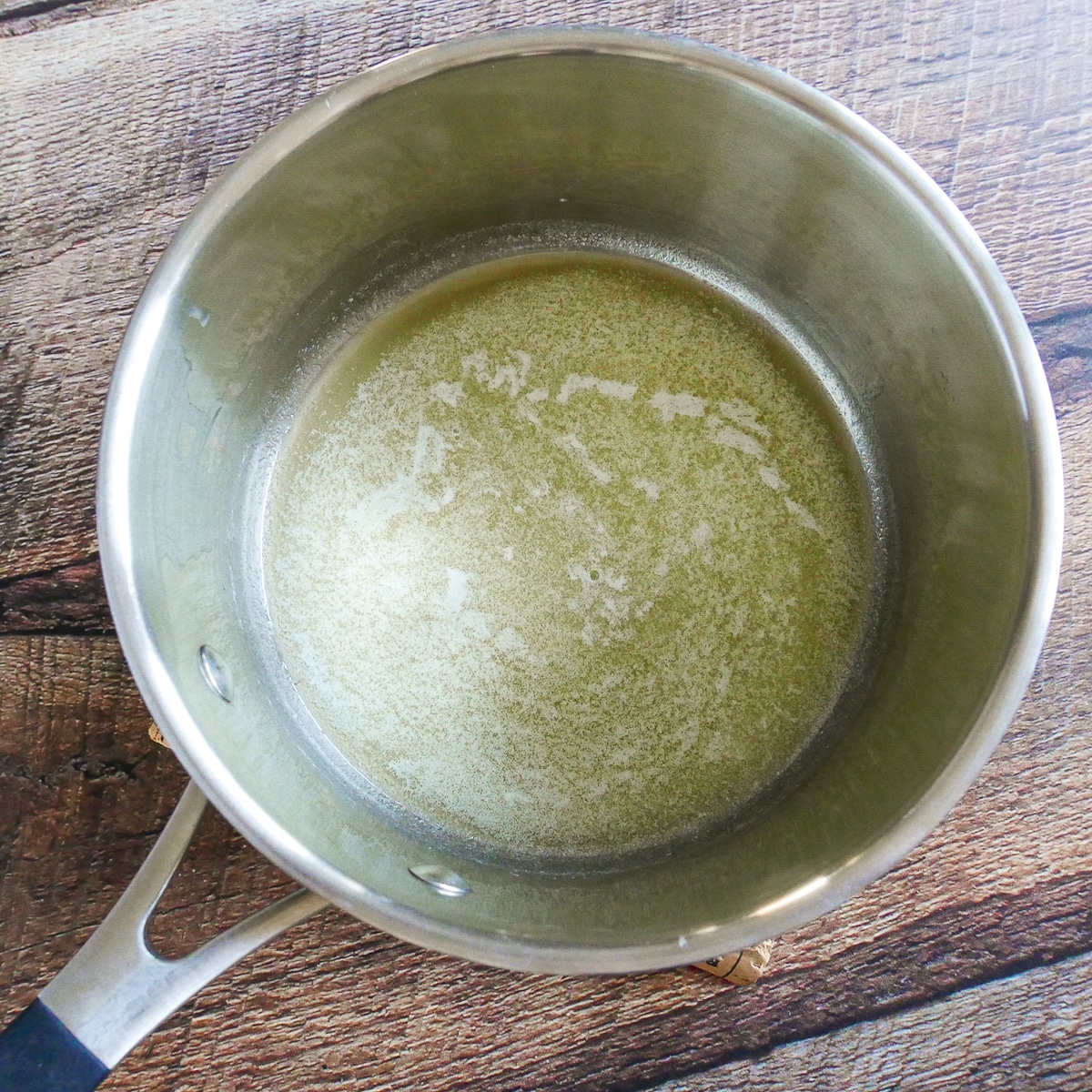 butter being melted in a saucepan.