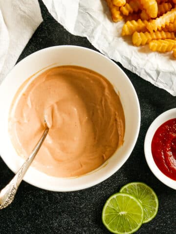 bowl of sriracha aioli with french fries.