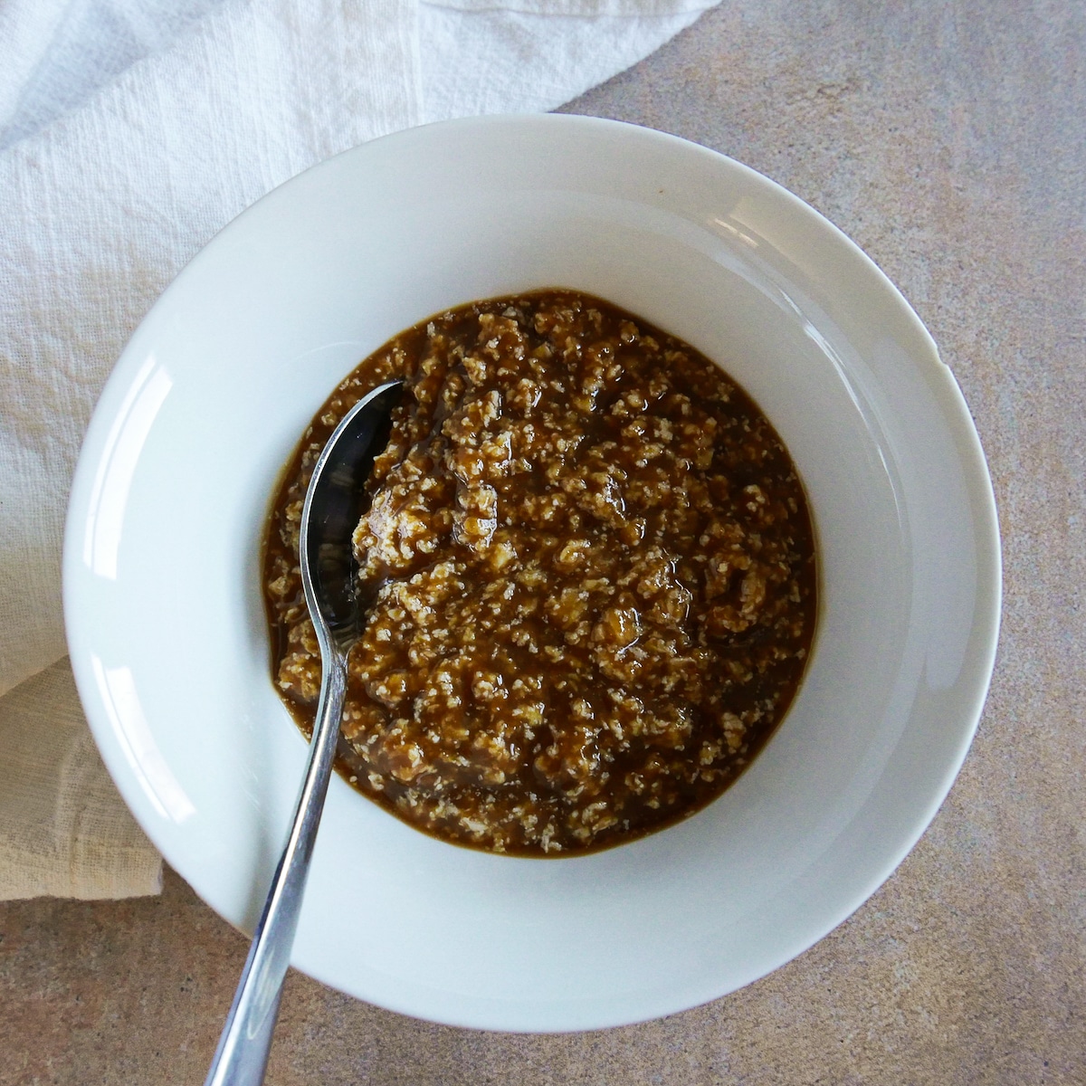 miso butter in a small white bowl with a spoon.