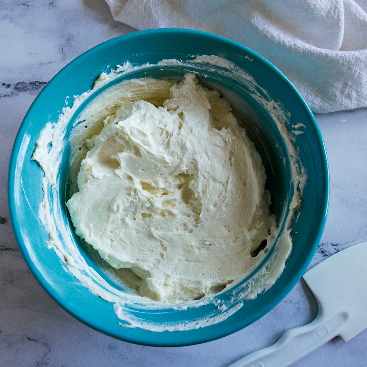 whipped cream in a blue bowl.