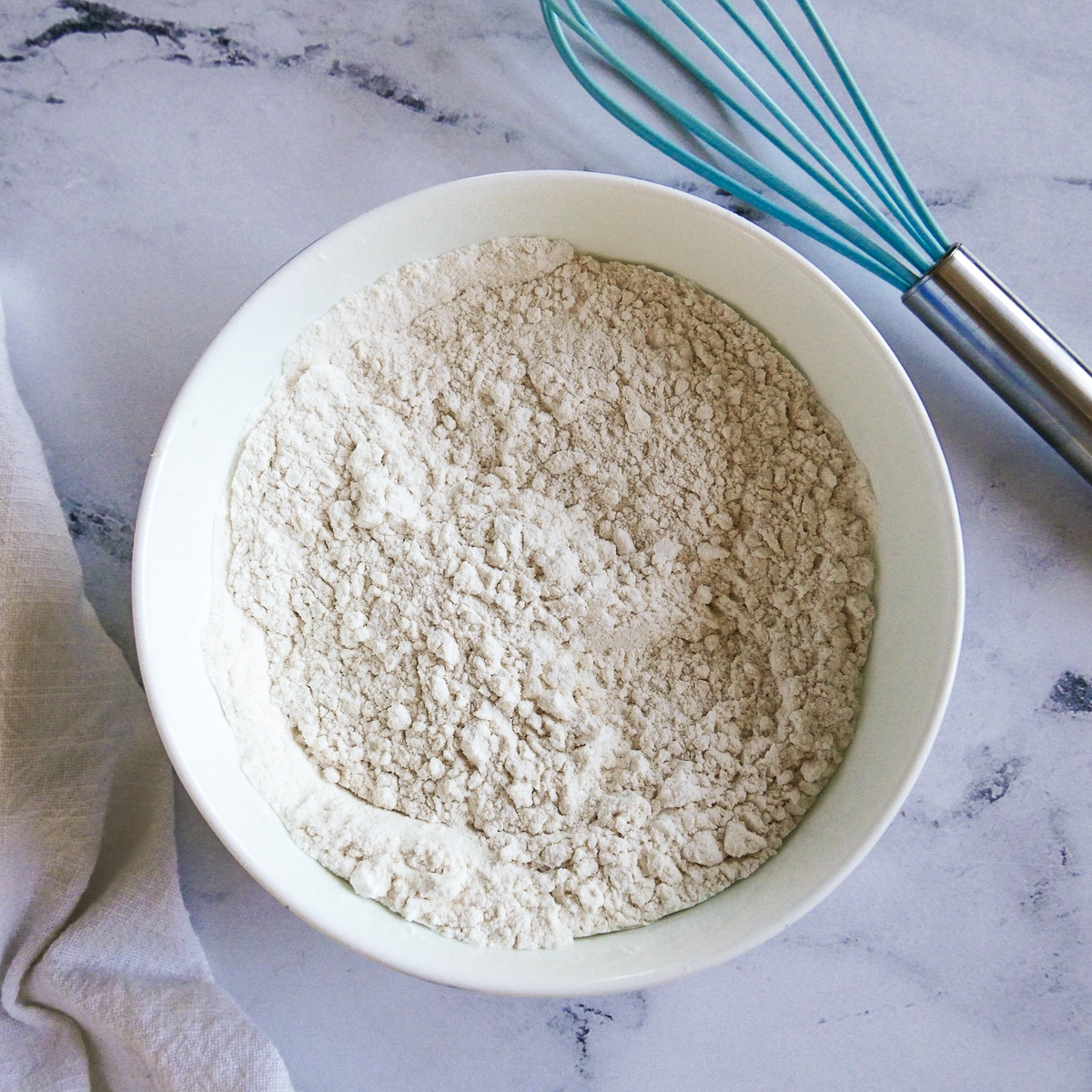 dry ingredients whisked together in a small white bowl.