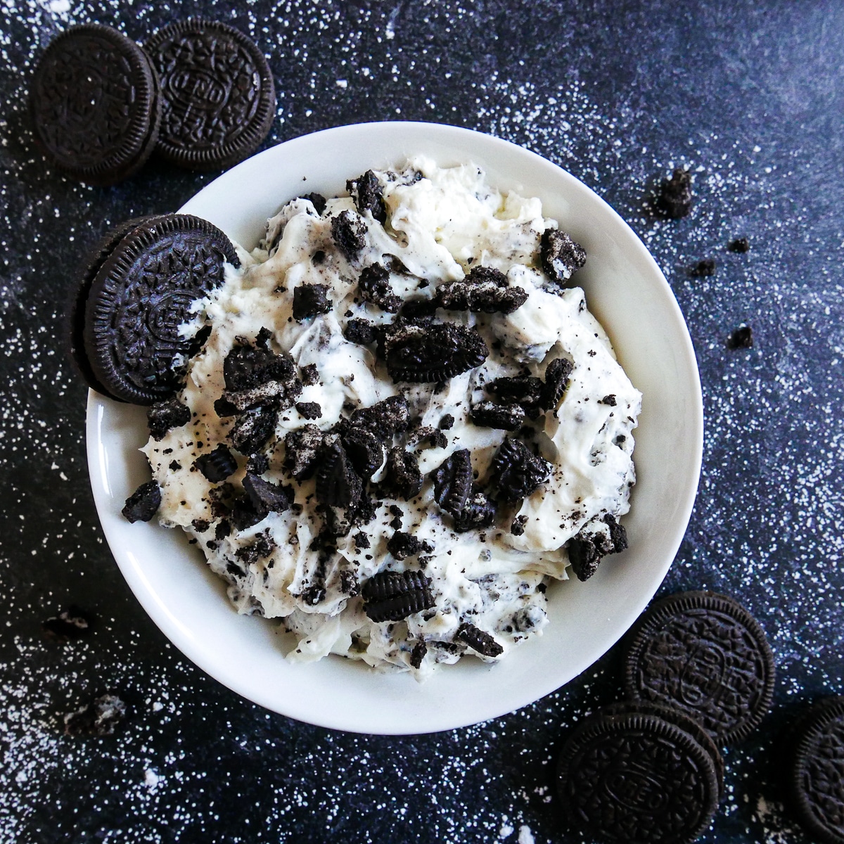 oreo-cookie-dip.jpg bowl of oreo cookie dip topped with crushed oreos.