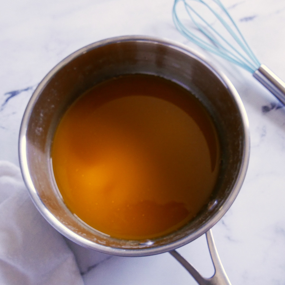 Vegetable broth warming in a pot.