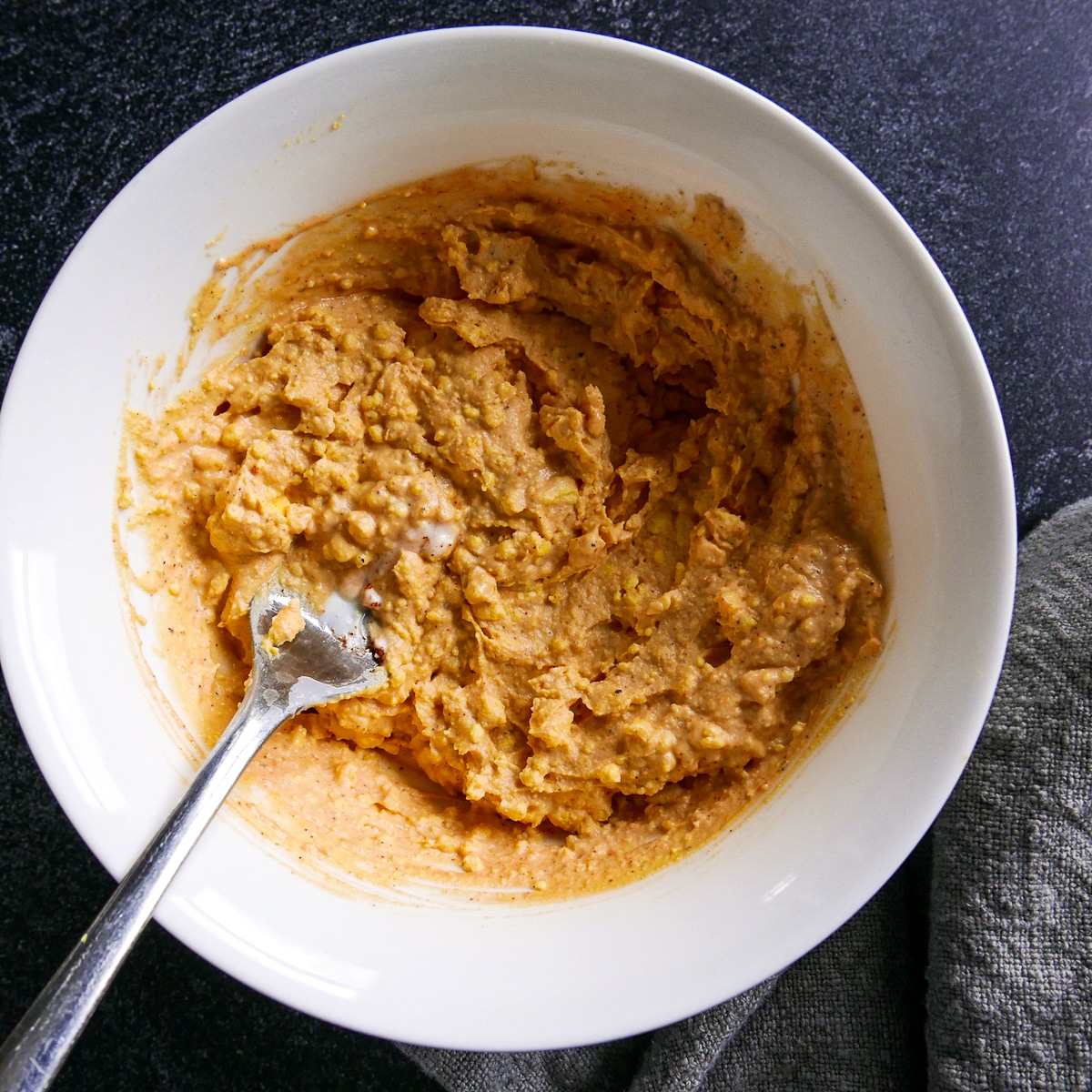 ingredients-mixed-together.jpg Ingredients being mixed together in a small white bowl.
