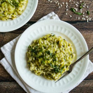 plate of zucchini risotto resting on a white napkin.