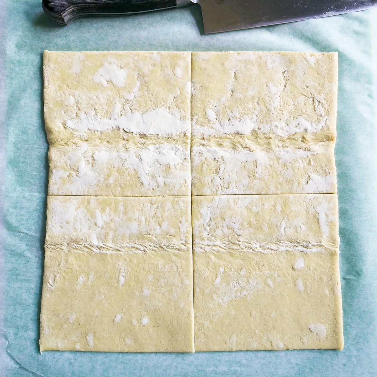 Sheet of puff pastry cut into 4 equal squares.