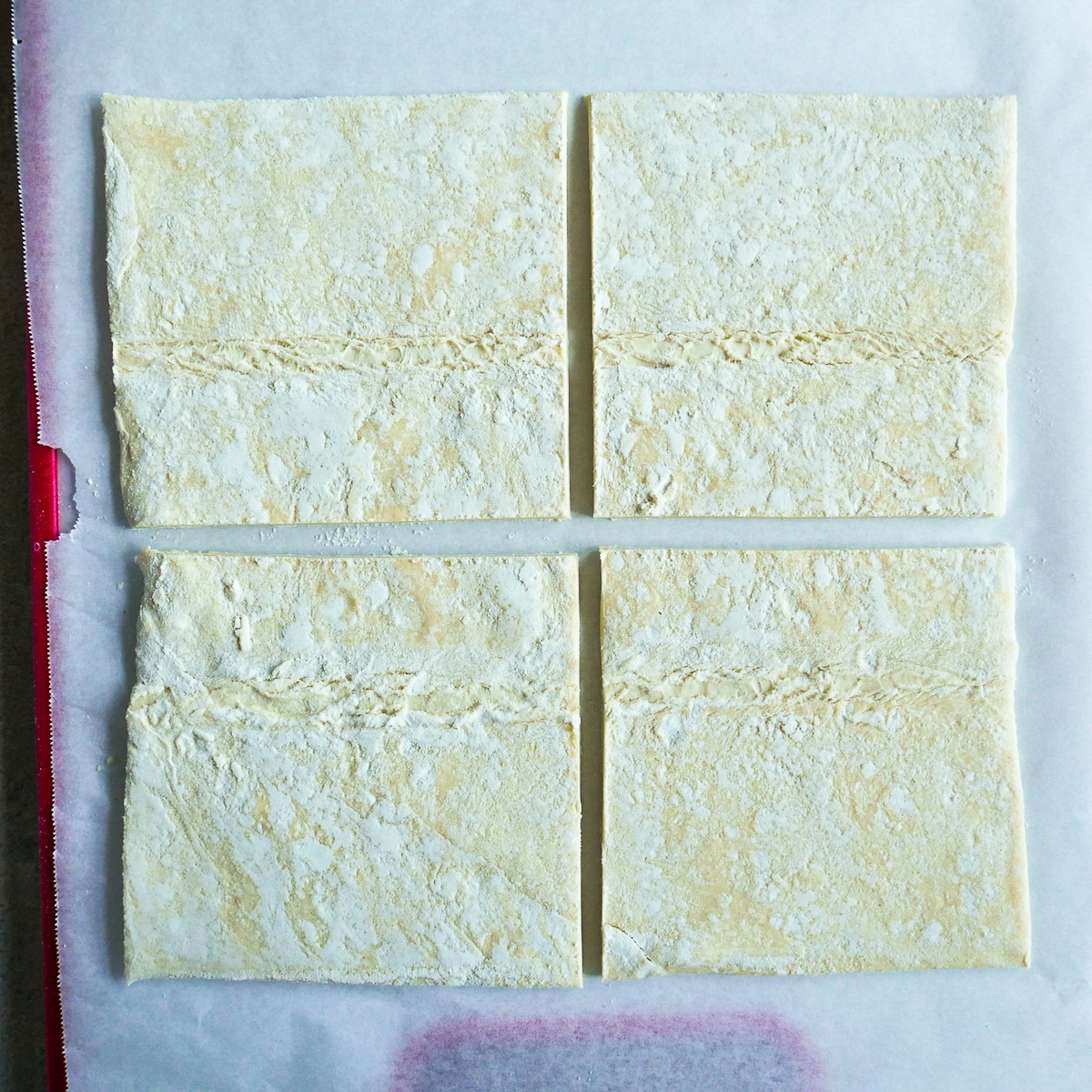 cut-pastry-sheets.jpg Pastry sheets cut into 4 equal squares.