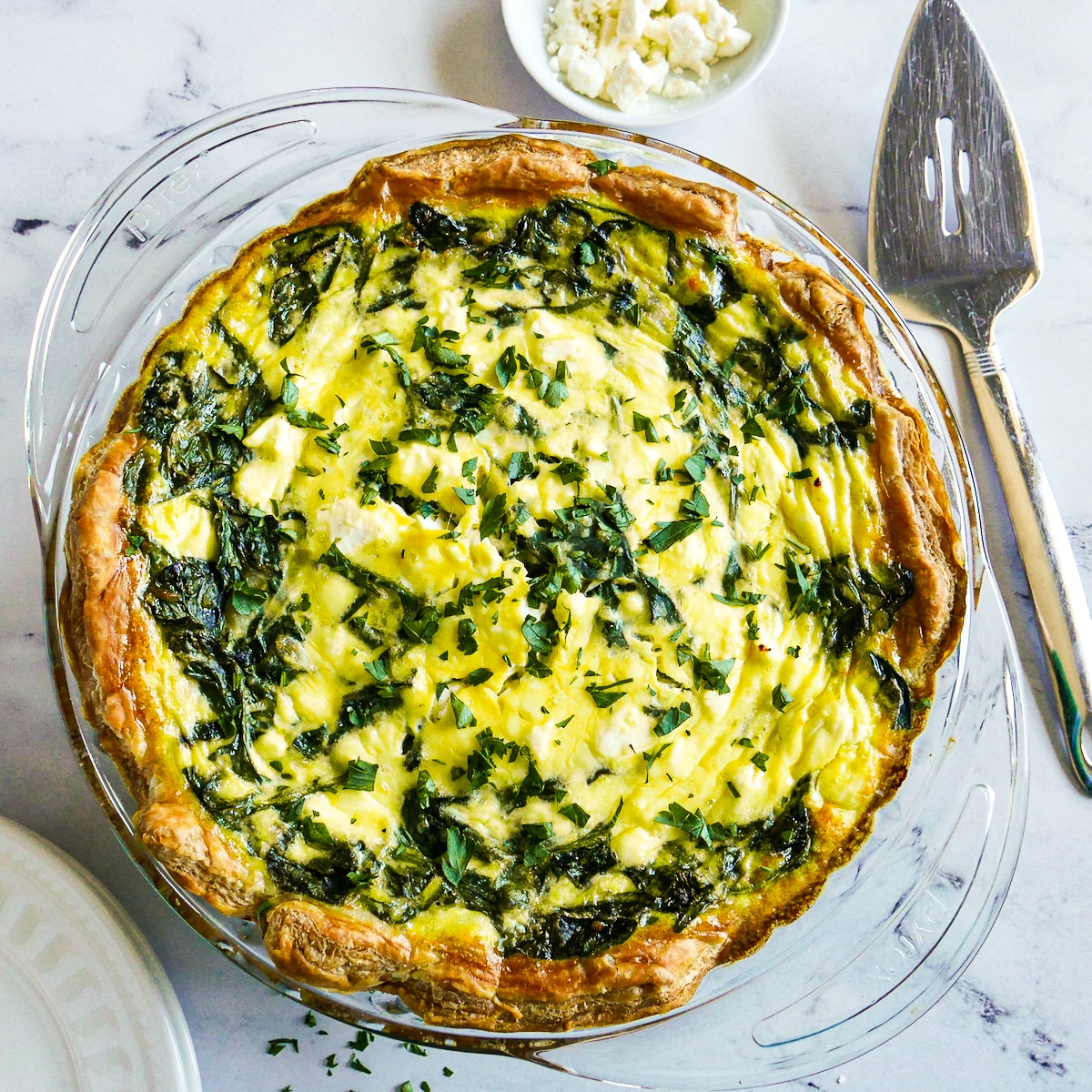 puff-pastry-quiche.jpg Puff pastry quiche arranged with a pie server.